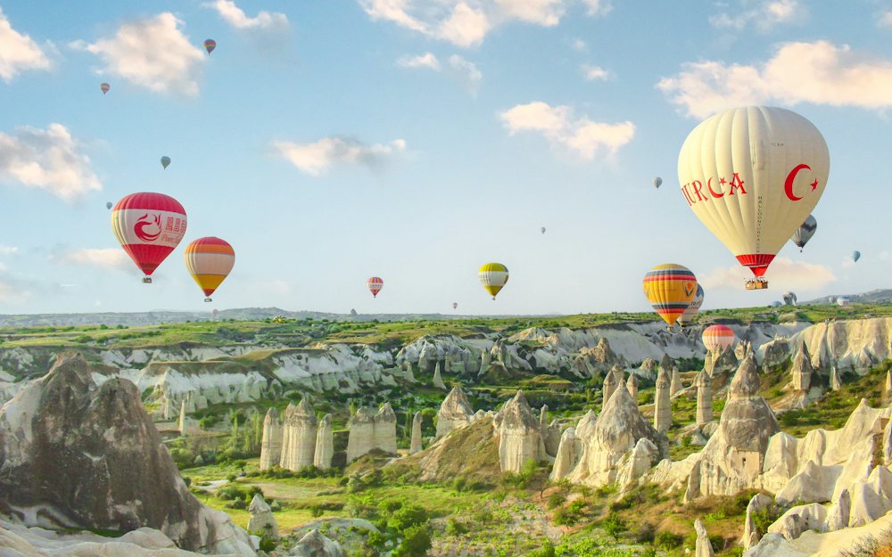 Hot-air balloons over the valleys of Cappadocia at sunrise